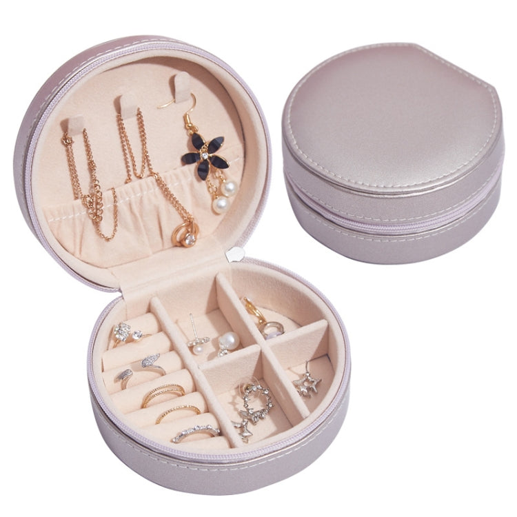 Round PU leather jewelry storage box, champagne gold exterior with beige-lined interior compartments