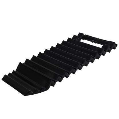 Black anti-slip tire traction mat with offset plate segments and mounting clips