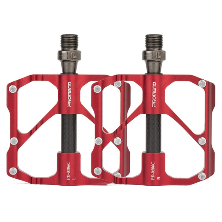 Red aluminum/carbon fiber bicycle platform pedals, dual studs and threaded axle.