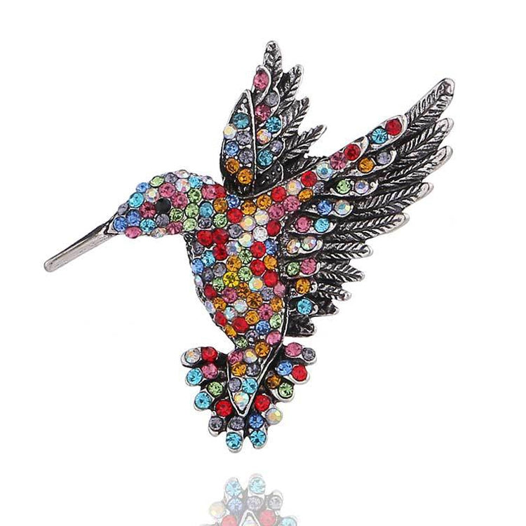 Multicolor rhinestone bird brooch with small wing details and metal pin back