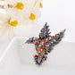 Colorful rhinestone bird brooch with layered wings and metal pin back