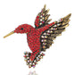 Red rhinestone bird brooch with gold-tone layered wings and metal pin back