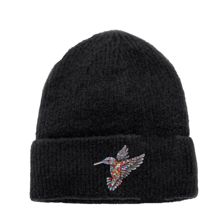 Black knit beanie with colorful bee bird brooch on the cuff