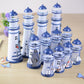 Set of blue and white tin lighthouse decorations with mesh towers and domed lantern tops
