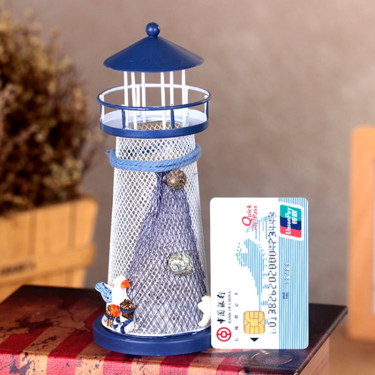 Blue and white tin lighthouse decoration with mesh tower and lantern top, with price label