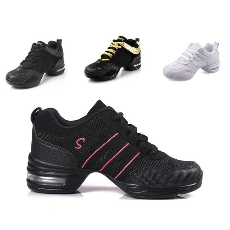 Athletic dance shoes set: black with gold accents, and white pair with white laces