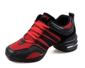Red and black breathable dance sneakers with lace-up closure and cushioned sole