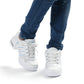 White lace-up breathable dance sneakers on feet with cushioned sole