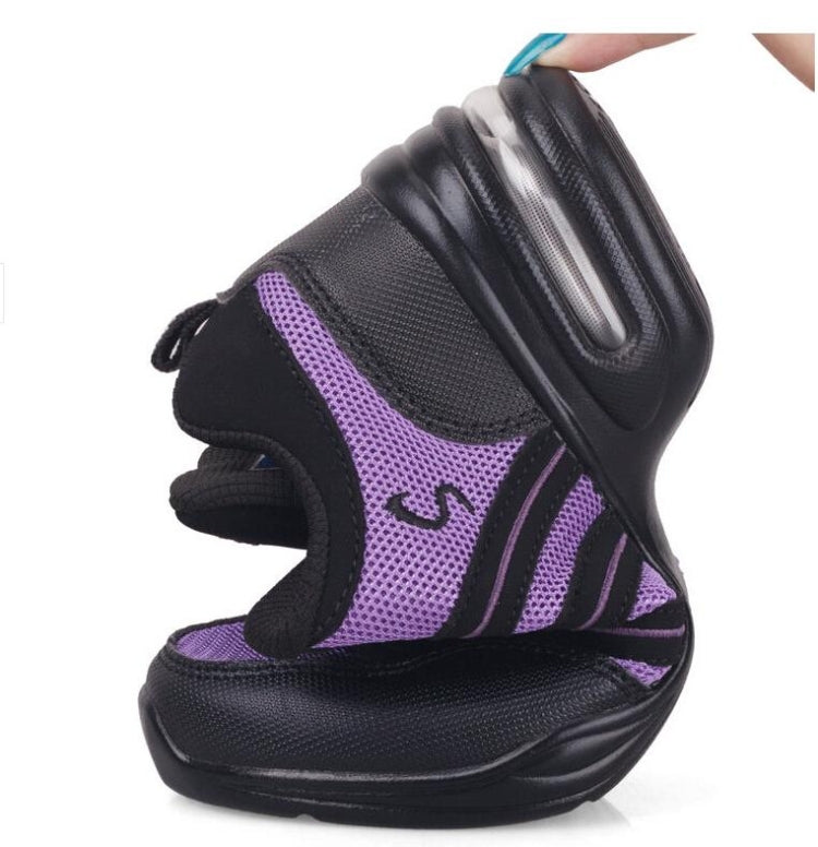 Black breathable dance sneakers with purple side panel and cushioned rocker sole