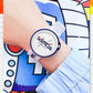 White dial silicone sports watch with blue rim and red-blue hands on white strap