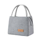 Gray insulated lunch tote bag with top handles and front logo patch with side zipper pocket