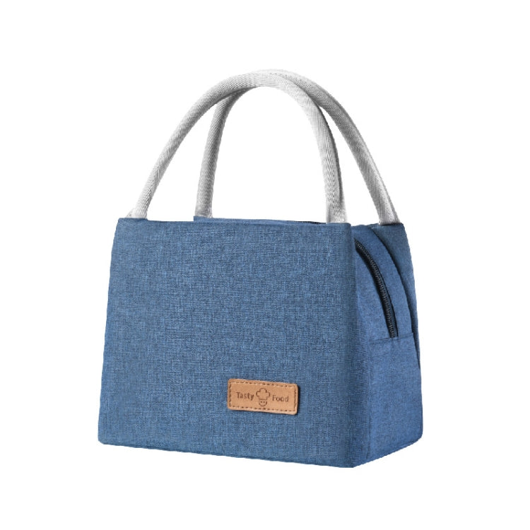 Blue insulated lunch tote bag with top handles, front logo patch, and side zipper pocket