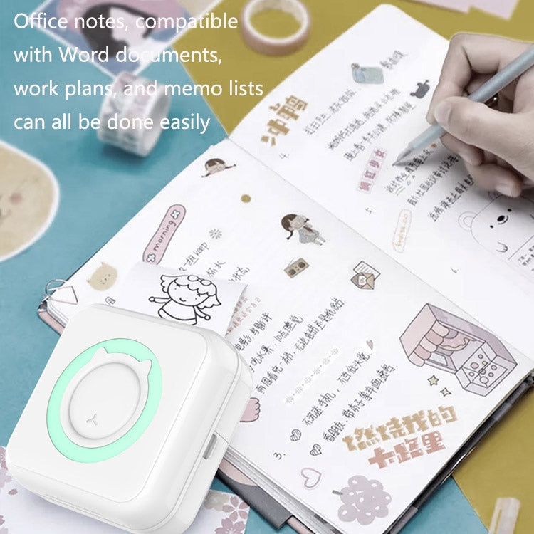 Mini thermal Bluetooth printer with mint green ring, beside printed document pages