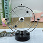 Rotating magnetic globe ornament with chrome ring and metal globe on black stand