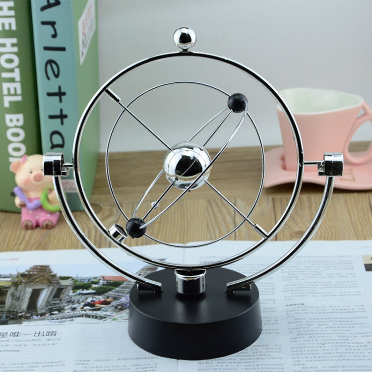 Rotating magnetic globe ornament with chrome ring and metal globe on black stand