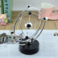 Rotating magnetic globe ornament with chrome ring, reflective silver globe, and black base