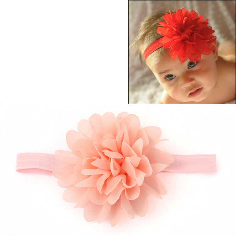 Light pink elastic baby girl hairband with large peach-toned fabric flower centerpiece