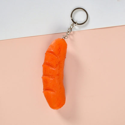 Orange hot dog-style vegetable keychain pendant with metal key ring