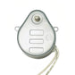 Two-way valve actuator motor with white front panel, oval metal body, and power wires