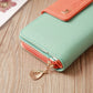 Two-tone long zipper wallet with mint green body, orange accent, and front card pocket.