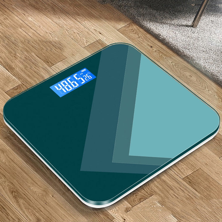 Teal smart scale with blue digital LCD weight display and glossy glass top