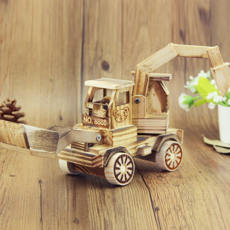 Wooden model excavator toy ornament with cab, tracks, and front bucket, light wood