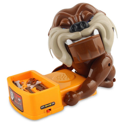 Cartoon poodle novelty trick toy with orange bite launcher and open inner parts