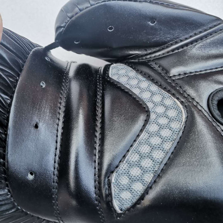Black half-finger glove close-up with textured breathable side panel