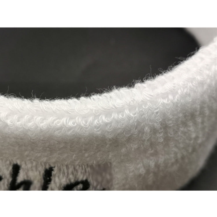 White knit sweatband close-up, textured terry-like fabric edge