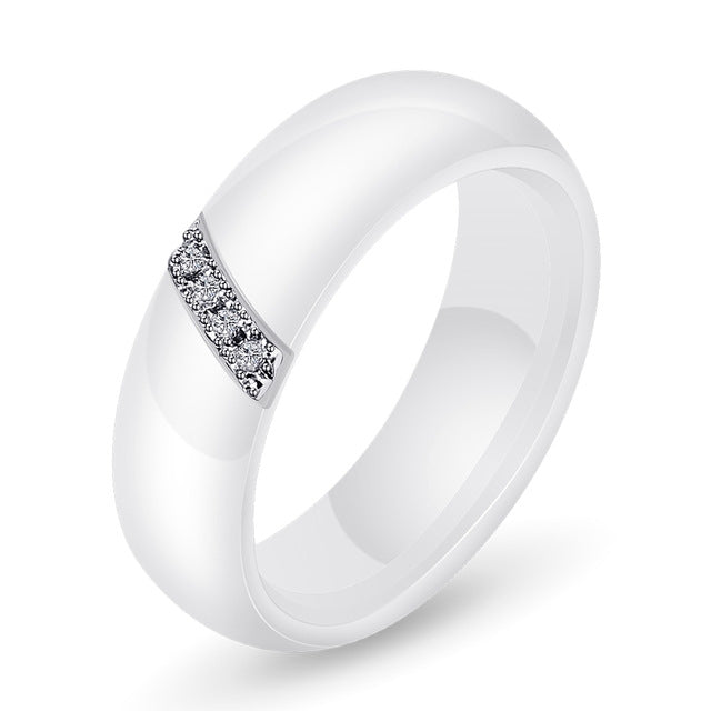 White ceramic zircon inlay ring, front three-quarter view