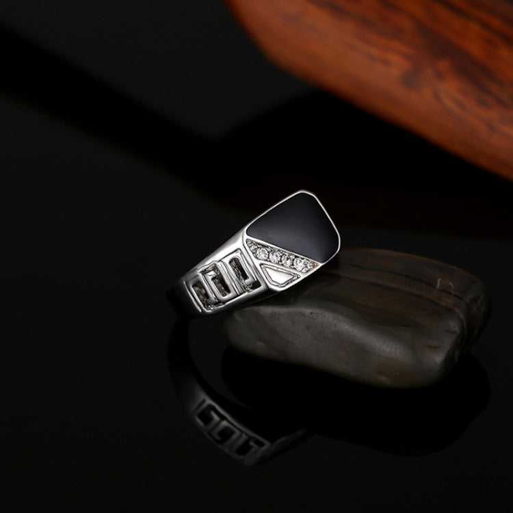 Silver-tone ring with black enamel top, rectangular accents, and rhinestone detail