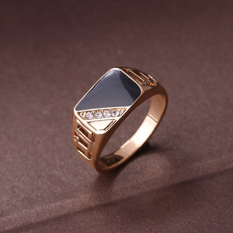 Gold-tone signet ring with black enamel face and rhinestone triangle center