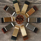 Set of metal pen holder clips with leather sleeves in mixed finishes