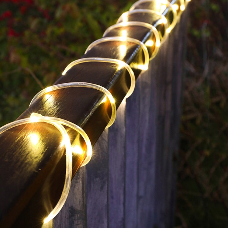 Warm white LED tube string lights close-up with bright bulbs along the cable