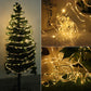 Warm white LED tube string lights wrapped around a small conifer tree
