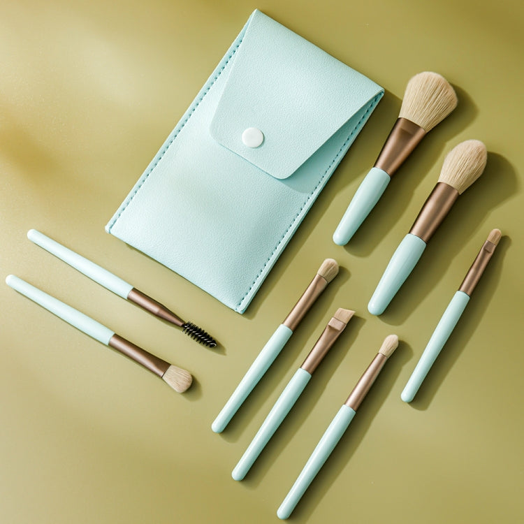 Light blue makeup brush set with 8 mini brushes and snap-closure leather pouch
