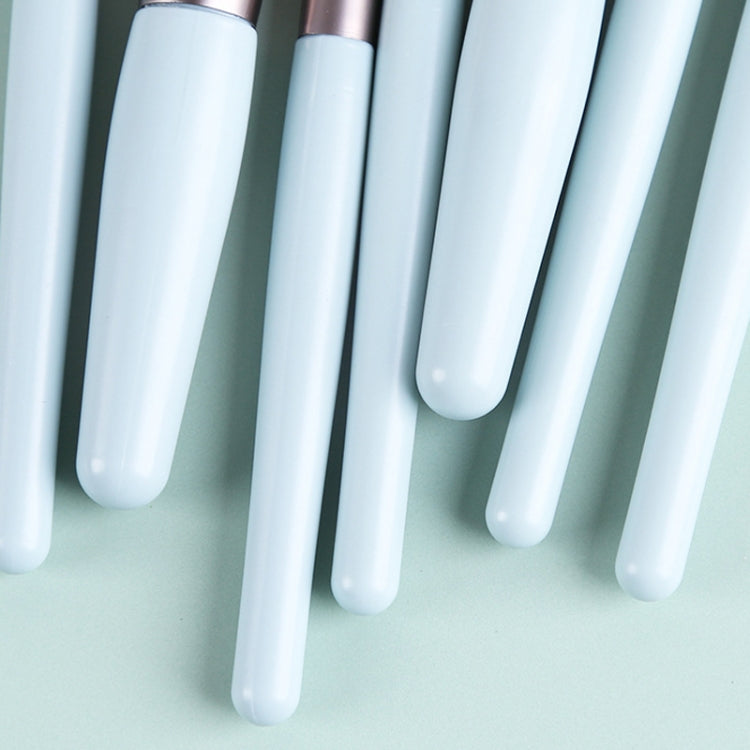 Close-up of sky blue mini brush handles with soft bristles