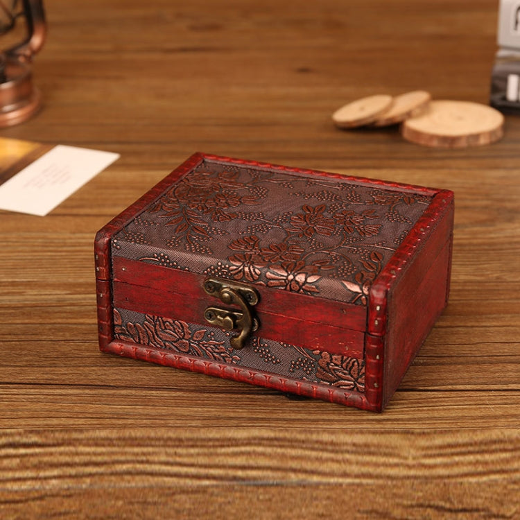 Vintage wooden jewelry box with red finish and engraved floral top, brass latch front