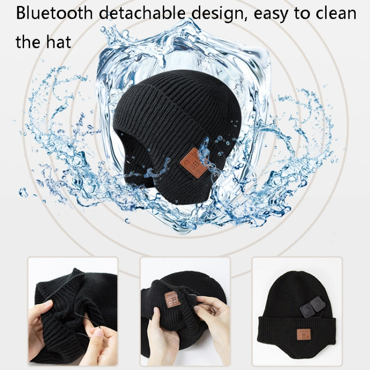 Black Bluetooth music hat with brown control patch, shown with splash graphic