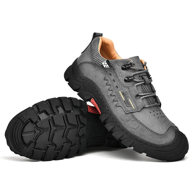 Grey lace-up hiking shoe with side strap detail and thick tread lug outsole
