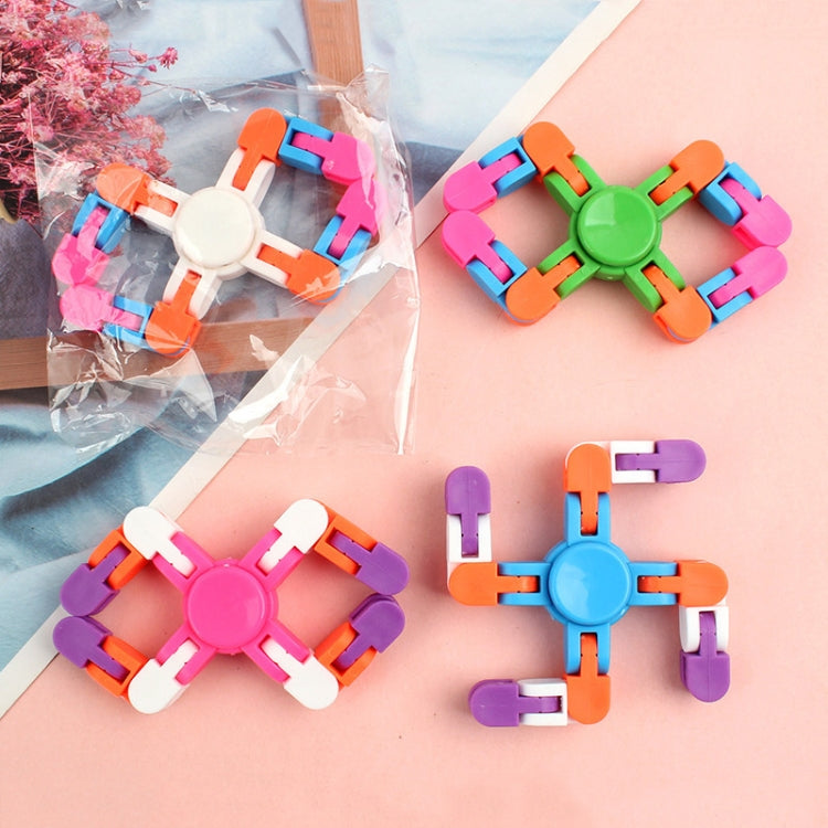 Set of colorful cross-shaped plastic finger spinner toys with rotating chain blocks