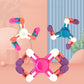 Pink and blue cross-shaped plastic finger spinner toy with rotating chain blocks