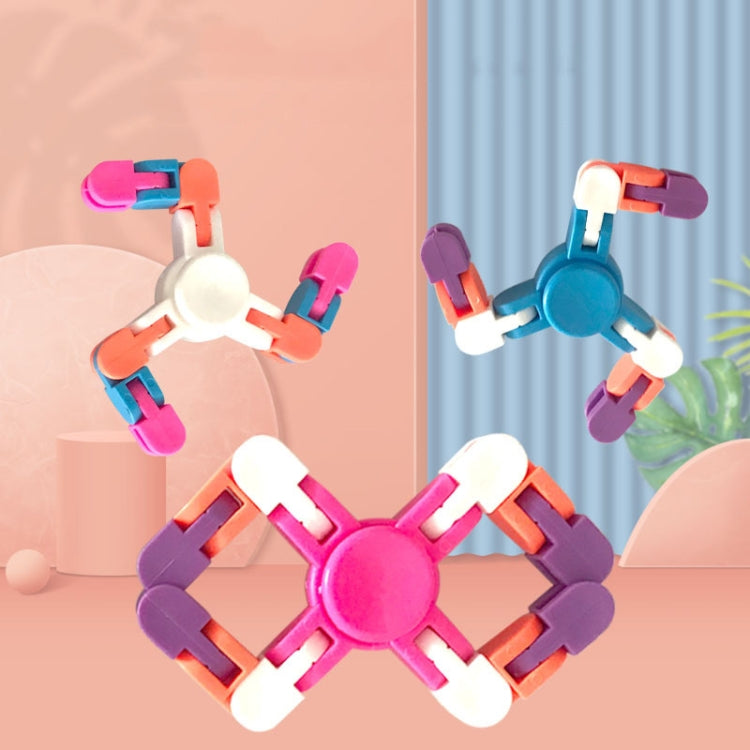 Pink and blue cross-shaped plastic finger spinner toy with rotating chain blocks