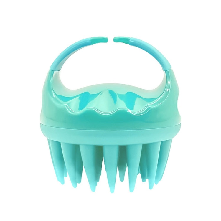 Teal silicone scalp hair washing brush with round handle and pointed bristles