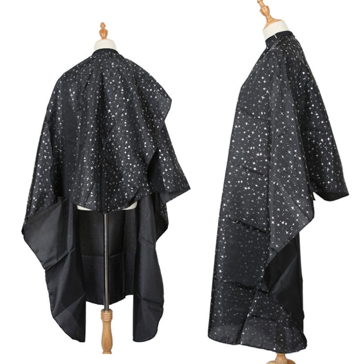 Black salon hair-dye cape with star speckle pattern, draped back and full coverage sleeves