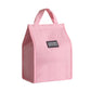 Insulated lunch box bag in pink with carry handles and front logo patch