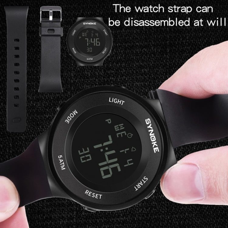 SYNOKE luminous LED watch with strap removed, showing green digital display