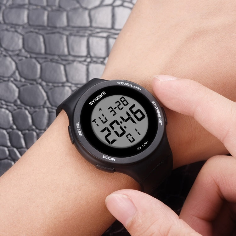 Black silicone sports LED watch with digital display, worn on a wrist