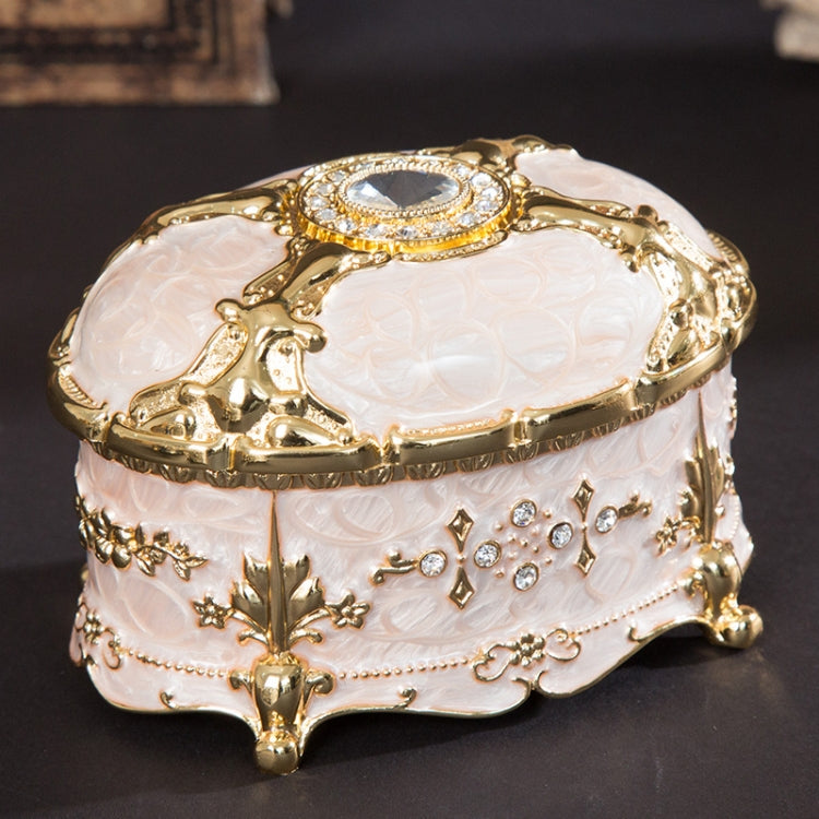 Gold-trim white oval jewelry storage box with diamond-style top and decorative bead details