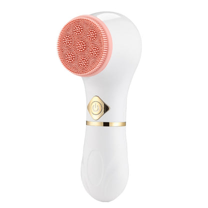 Electric facial cleansing brush with pink silicone cleansing head and power button